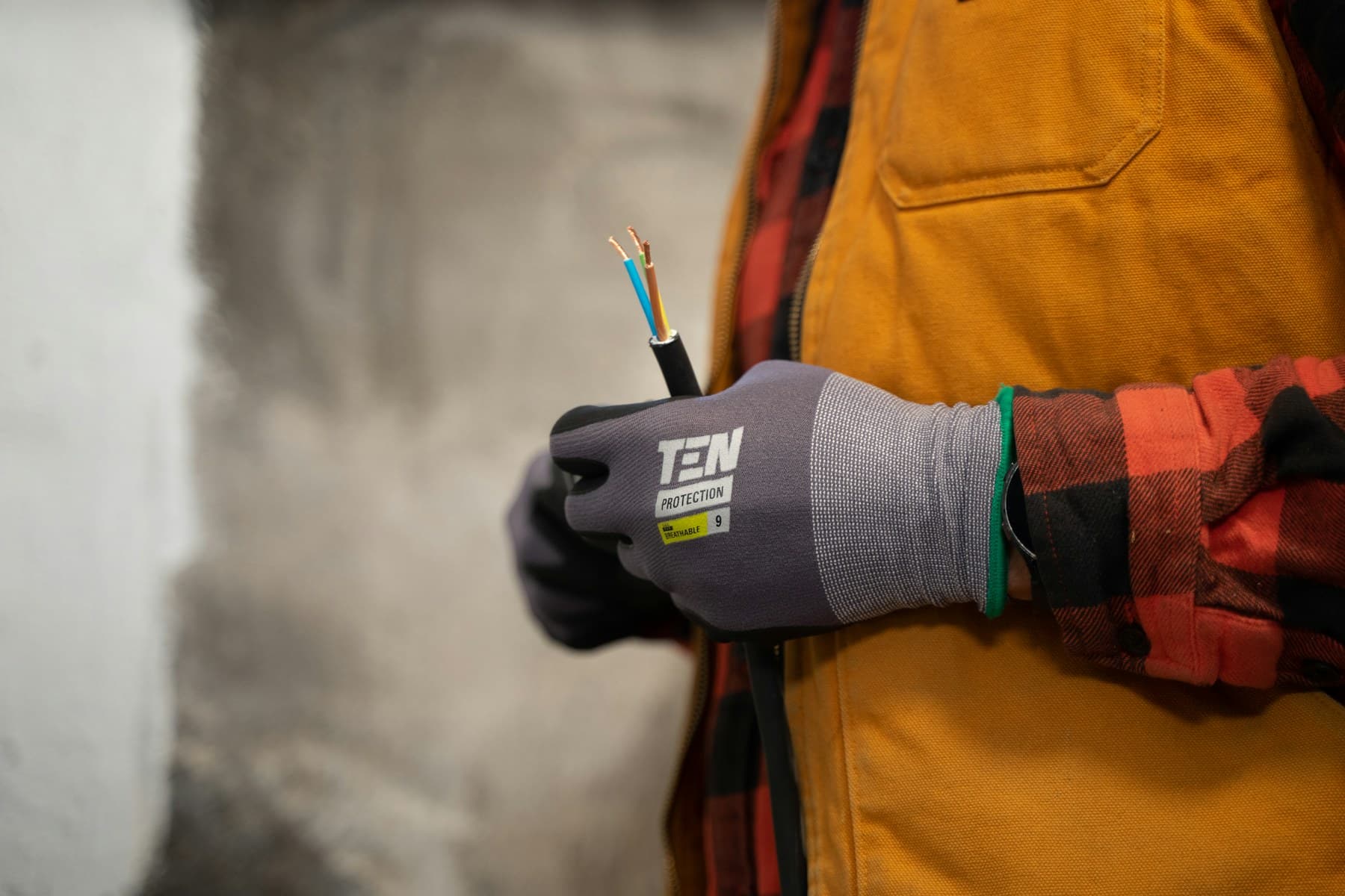 Electrician holding a pair of wires